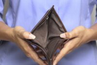 Person holding an empty wallet - showing bankruptcy