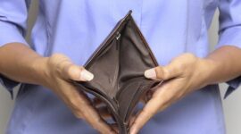 Person holding an empty wallet - showing bankruptcy