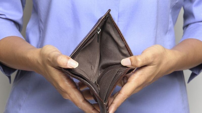 Person holding an empty wallet - showing bankruptcy